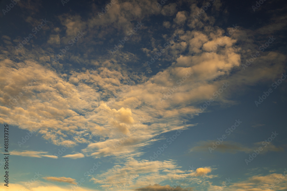 Beautiful small scattered clouds in the sky during sunset. Resource for designers