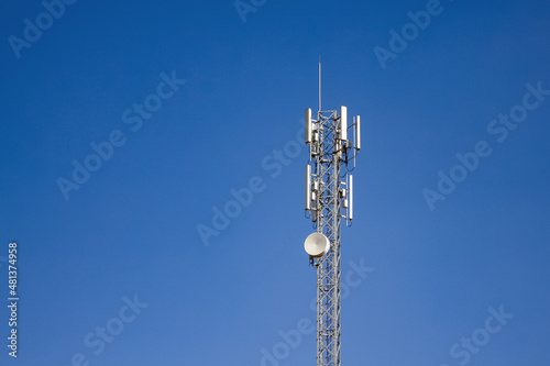 upward of Communication Radio antenna Tower, microwave antenna tower on blue sky background