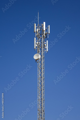 upward of Communication Radio antenna Tower, microwave antenna tower on blue sky background