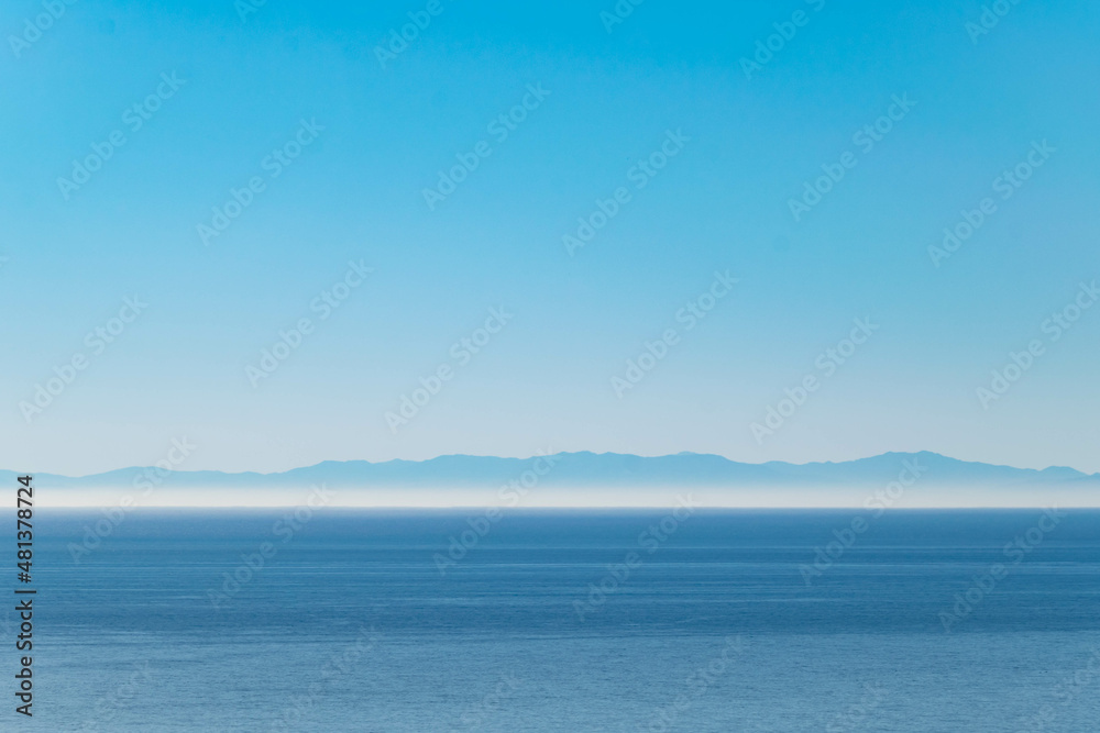 a blue sky landscape across the Mediterranean Sea at the northern coast of Africa 