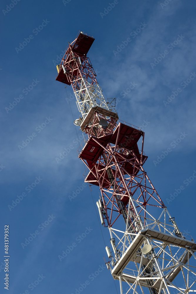 Telecommunications antenna for radio, television and telephony whit cloud and Blue sky Telecommunications antenna for radio, television and telephony whit cloud and Blue sky