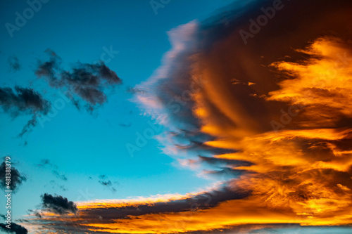 Golden orange clouds against blue skies over the Mediterranean during sunset wallpaper background