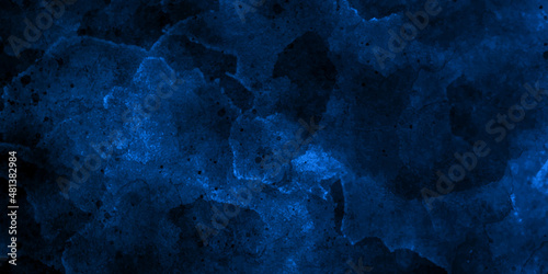 Abstract dark blue gradient paint background. Acrylic texture space nebula like pattern, Modern creative deep dark glowing blue neon watercolor on black paper illustration. © Grave passenger