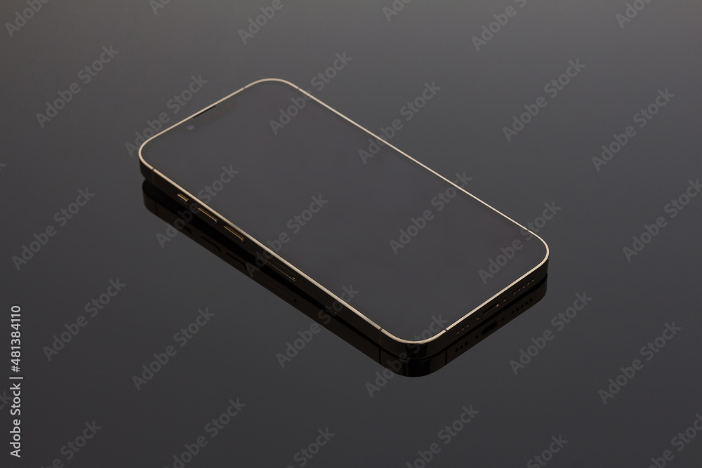 A closeup shot of a modern black smartphone on a black background. Mock up, technology and communication concept A closeup shot of a modern black smartphone on a black background. Mock up, technology and communication concept