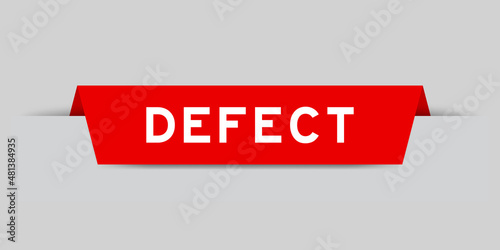 Red color inserted label with word defect on gray background