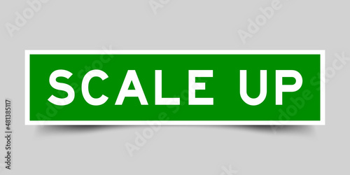 Square label banner with word scale up in green color on gray background photo