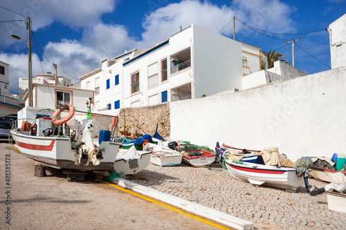 Fishing boats in the village centre of Burgau in the Algarve photo