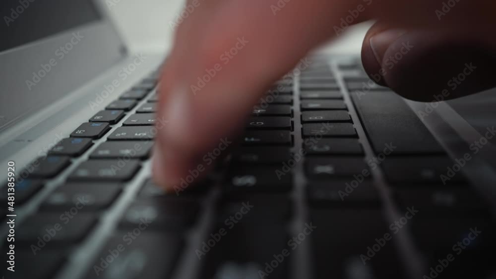 Person typing on laptop keyboard, fingers touching buttons. Extreme closeup somebody using device for work, tracking shot. Concept of business Person typing on laptop keyboard, fingers touching buttons. Extreme closeup somebody using device for work, tracking shot. Concept of business