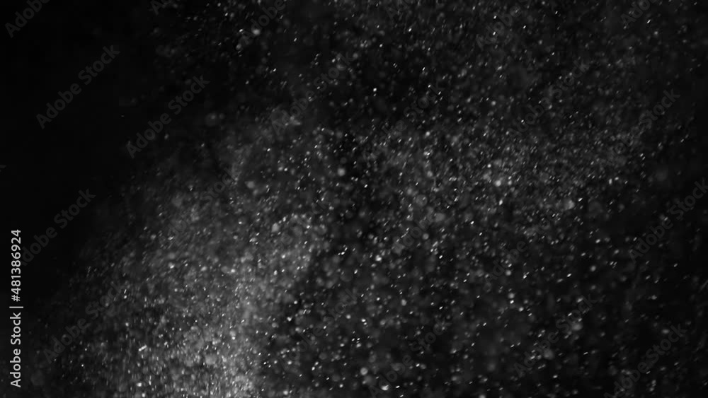 Natural dust particles on black background. Slow motion. Natural dust particles on black background. Slow motion.