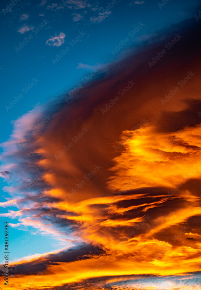 A golden swooping cloudy weather front portrait blowing in over the Mediterranean coastline of Marbella