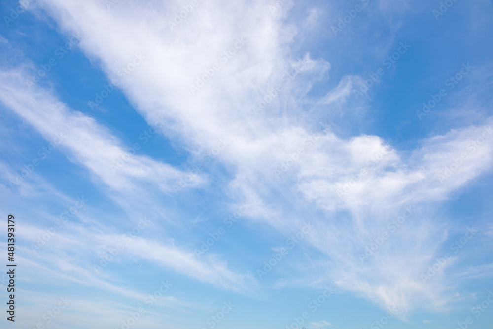 Blue sky with small white clouds for background usage.