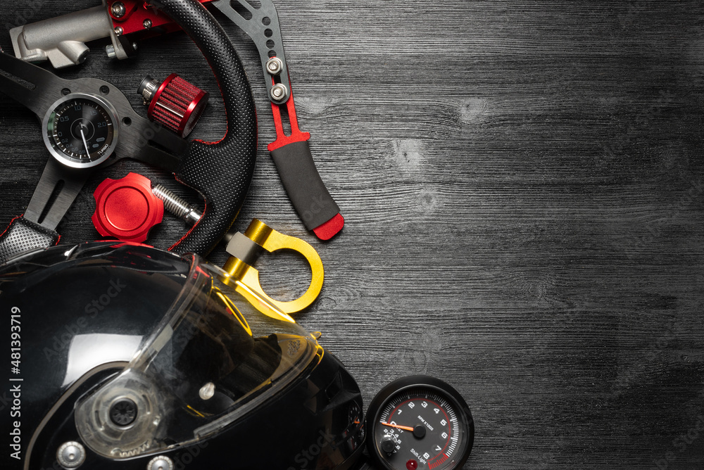 Car tuning equipment and accessories on the black table flat lay background. Car tuning equipment and accessories on the black table flat lay background.