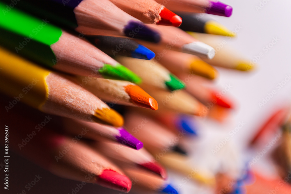 Fototapeta premium macro photo of multicolored pencil leads on a white background