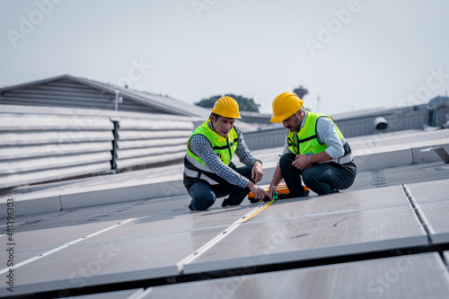Wallpaper Mural Engineer wearing unifrom and helmet inspect and check solar cell panel ,solar cell is ecology energy sunlight power installation for industrail ,alternative environment power concept.	
 Torontodigital.ca