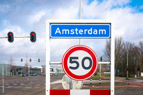 Location sign of the city of Amsterdam, The Netherlands. Sign below means speed limit in zone is 50.