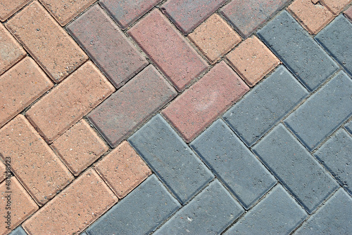 Close Up of Coloured Blocks in Concrete Pavement 