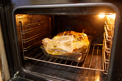 the duck is baked in an electric oven in a cooking bag