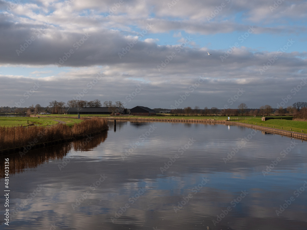 Cloud reflection on river Eem in the Netherlands in farmland area Soest