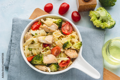 Tagliatelle pasta with chicken, broccoli, and cherry tomatoes