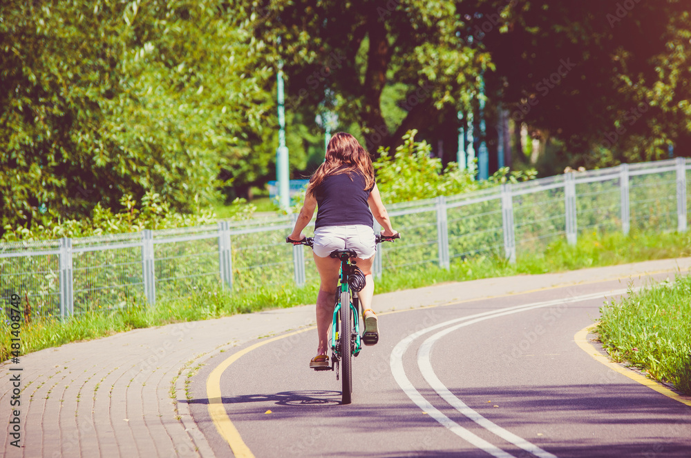 Cyclist ride on the bike path in the city Park
