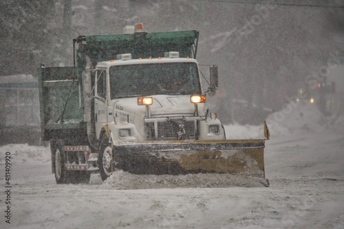 Snow removal crews cleaning city streets.