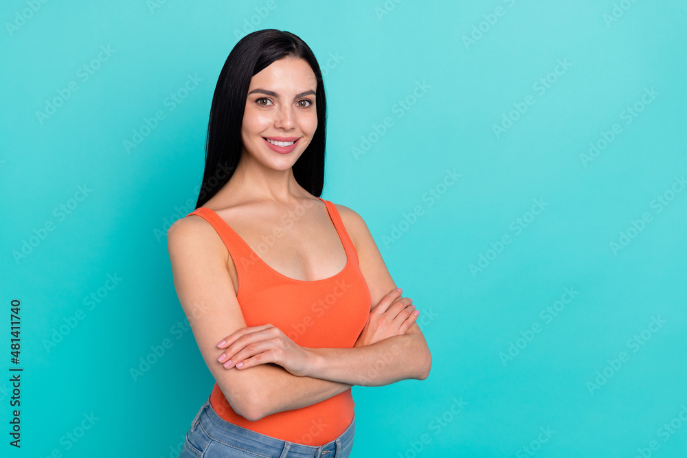 Photo of adorable nice glad lady crossing arms enjoy travel trip isolated over aquamarine color background Photo of adorable nice glad lady crossing arms enjoy travel trip isolated over aquamarine color background