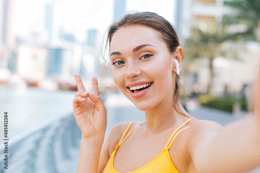 Young beautiful woman take a selfie picture on her smartphone Young beautiful woman take a selfie picture on her smartphone