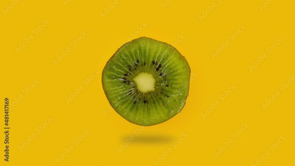 Cutting kiwi fruit into slices. Cut single kiwi. Vitamins and benefits of a fresh and tasty kiwi. Organic and Vegetarian dessert. Preparing fruits for salad.