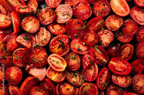 a lot of cut tomatoes for drying