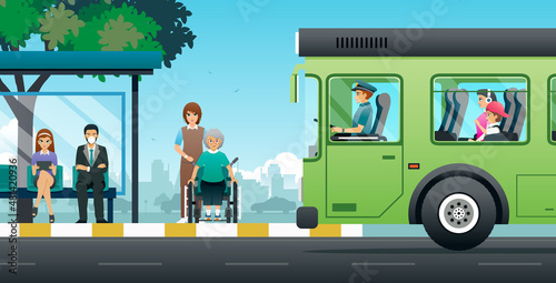 The bus driver stopped safely to pick up passengers and wheelchair users at the stop.
