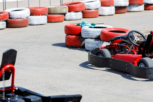 racing cars on a kart track limited by red tires