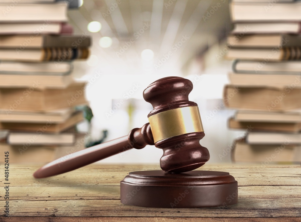 Legal Law and Justice concept, law book with a wooden judges gavel on table Legal Law and Justice concept, law book with a wooden judges gavel on table