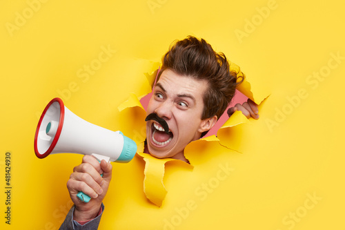 Crazy man shouting in loudspeaker in studio