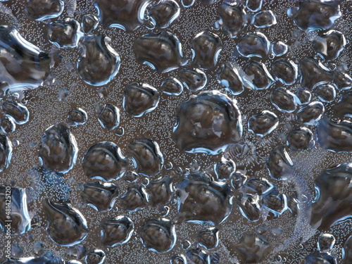 Closeup of water droplets on Perspex sheet photo