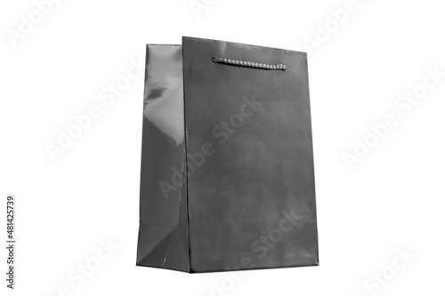 paper bag for shopping or gift delivery, branded designer packet for gray color with rope handle without label, isolated object with copy space.