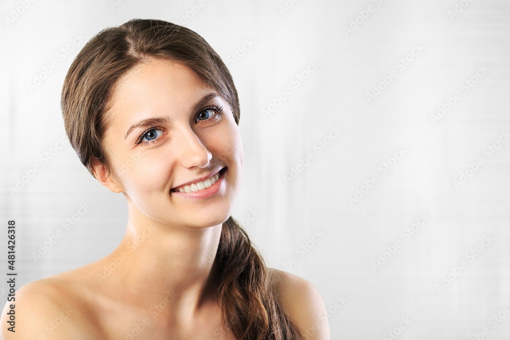 Beautiful young woman with clean perfect glowing skin, smiling Beautiful young woman with clean perfect glowing skin, smiling