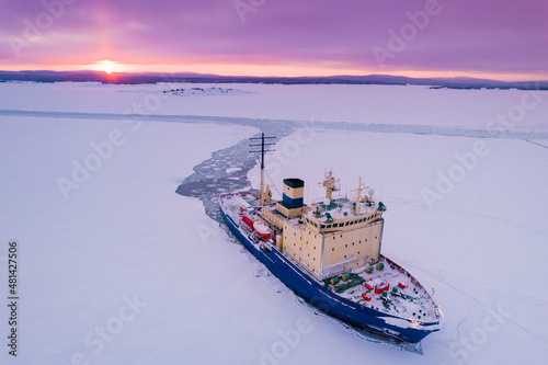 Canvas Print Icebreaking vessel in Arctic with background of sunset