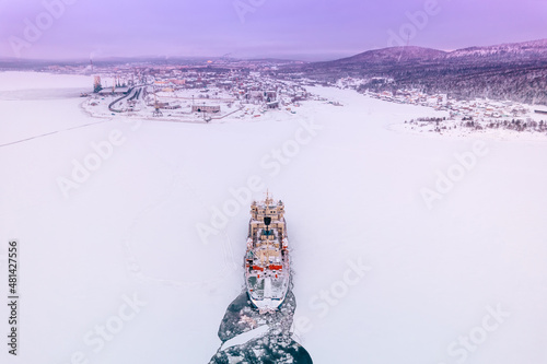Icebreaking vessel in Arctic with background of sunset