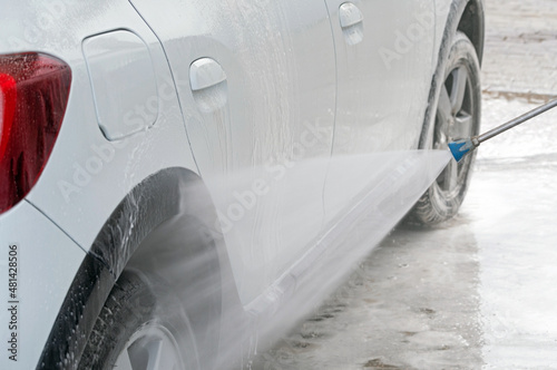 white passenger car at a car wash