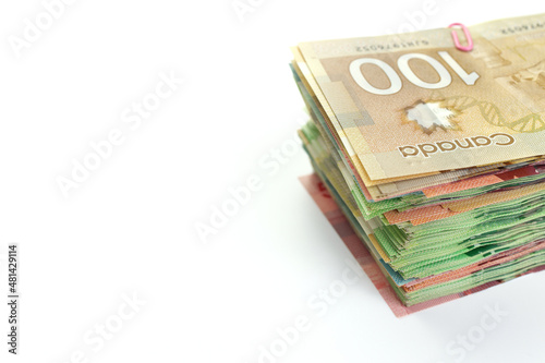 High Angle View of Large Stack of Canadian Banknotes on a White Background