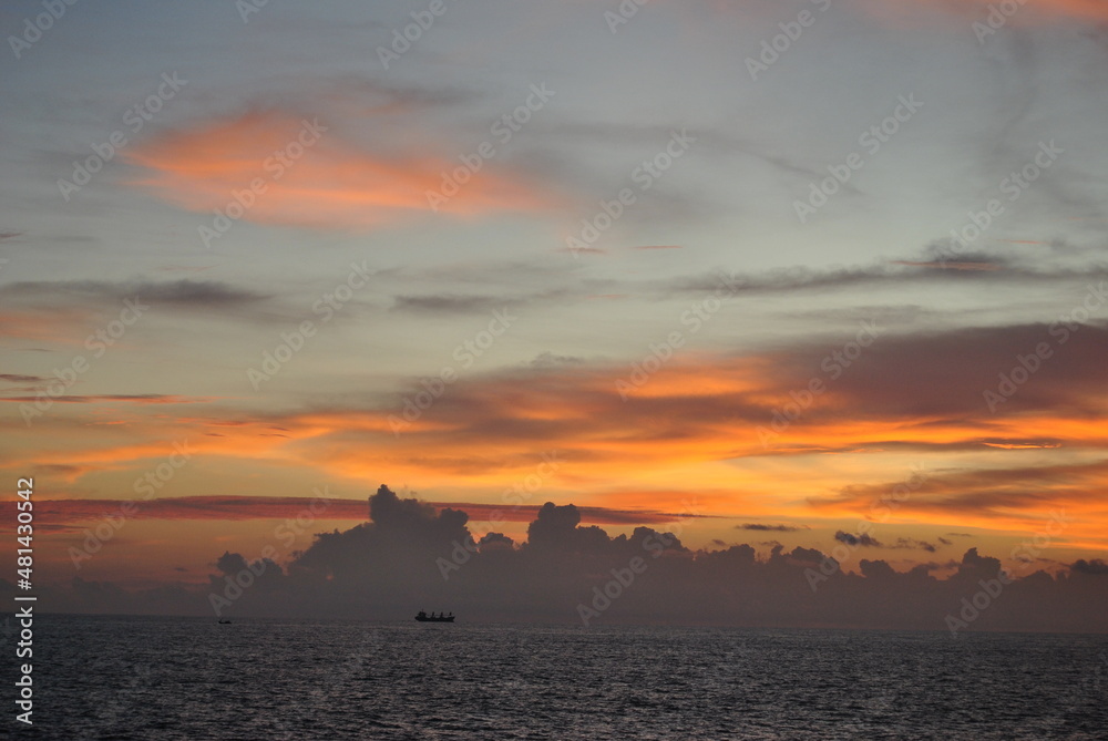 Sunset in Sri Lanka. Golden sunset on the sea. Ships at sunset. Sunset on the ocean. Sunrise.
