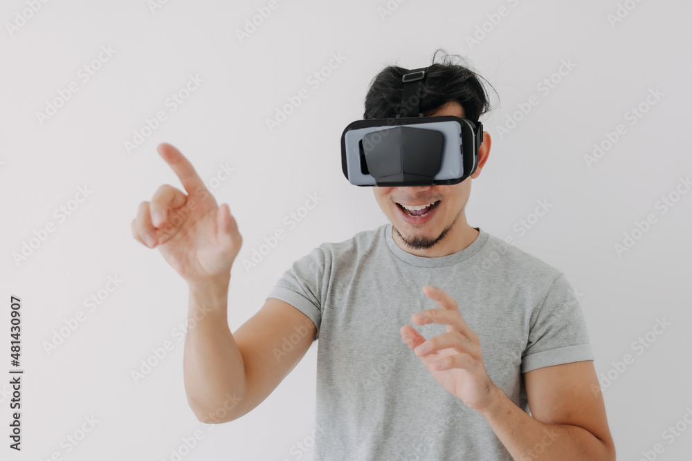 Asian man wears virtual glasses for interactive virtual meta world technology. Asian man wears virtual glasses for interactive virtual meta world technology.