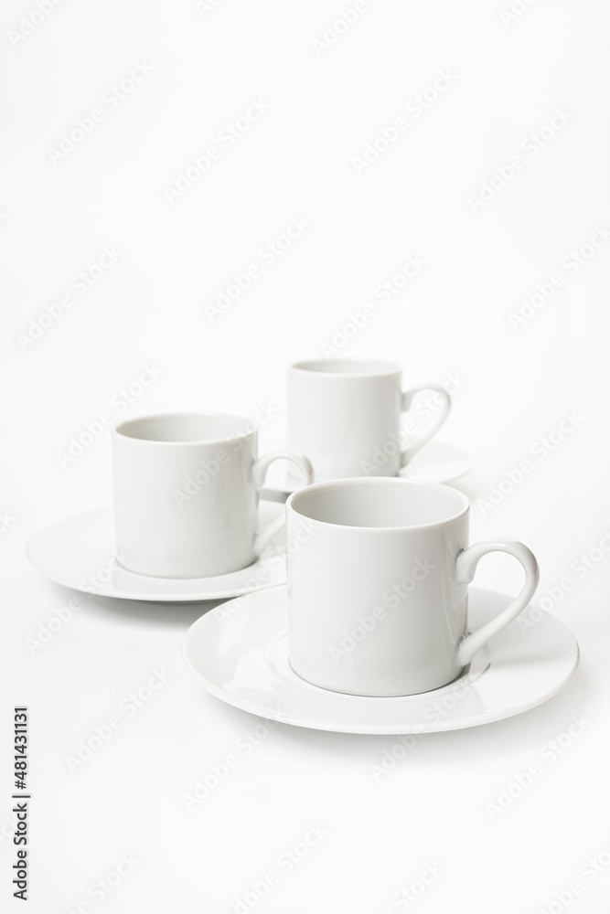 White porcelain cup and saucer for cappuccino and coffee isolated on a white background White porcelain cup and saucer for cappuccino and coffee isolated on a white background