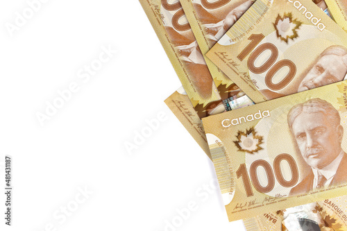 Directly Above Image of Crisp Canadian 100 One Hundred Dollar Bills on a White Background