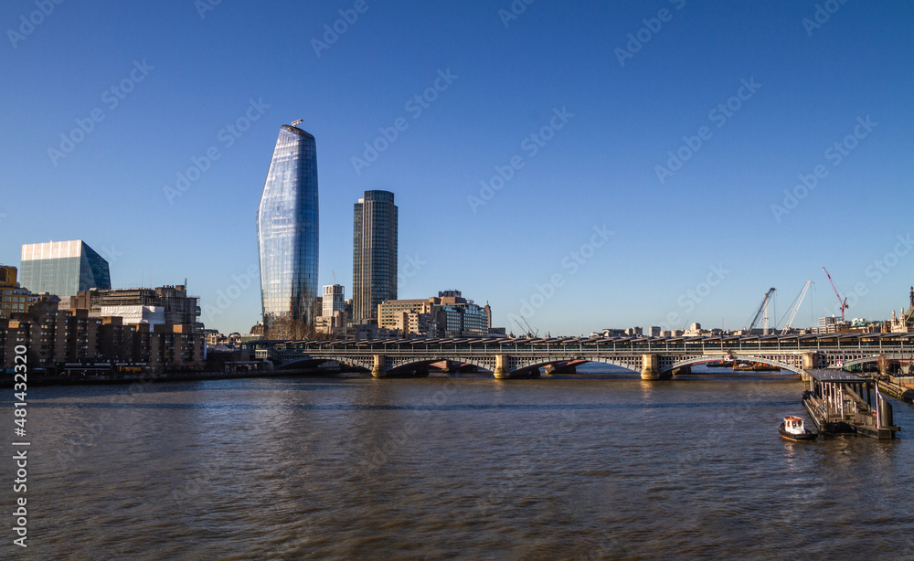 One Blackfriars (The Vase or The Boomerang) skyscraper and Blackfriars Railway Bridge, crossing the River Thames on January 16, 2019 in London, England, United Kingdom.