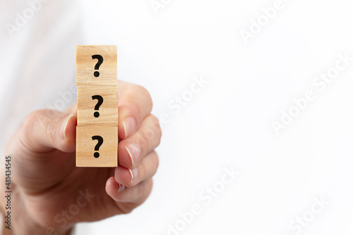 question mark icon on wooden cubes. Problem and solution concept.