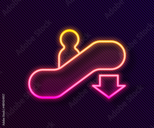 Glowing neon line Escalator down icon isolated on black background. Vector