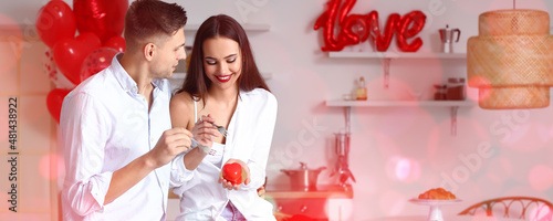 Beautiful young couple eati...