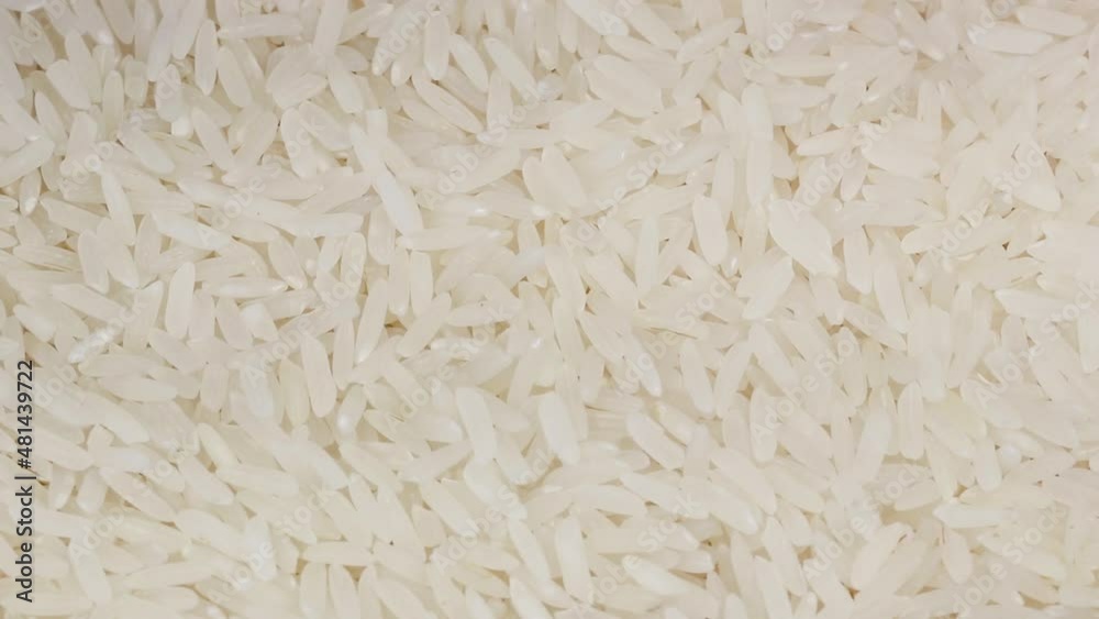 Closeup of uncooked white rice rotating. Closeup of uncooked white rice rotating.