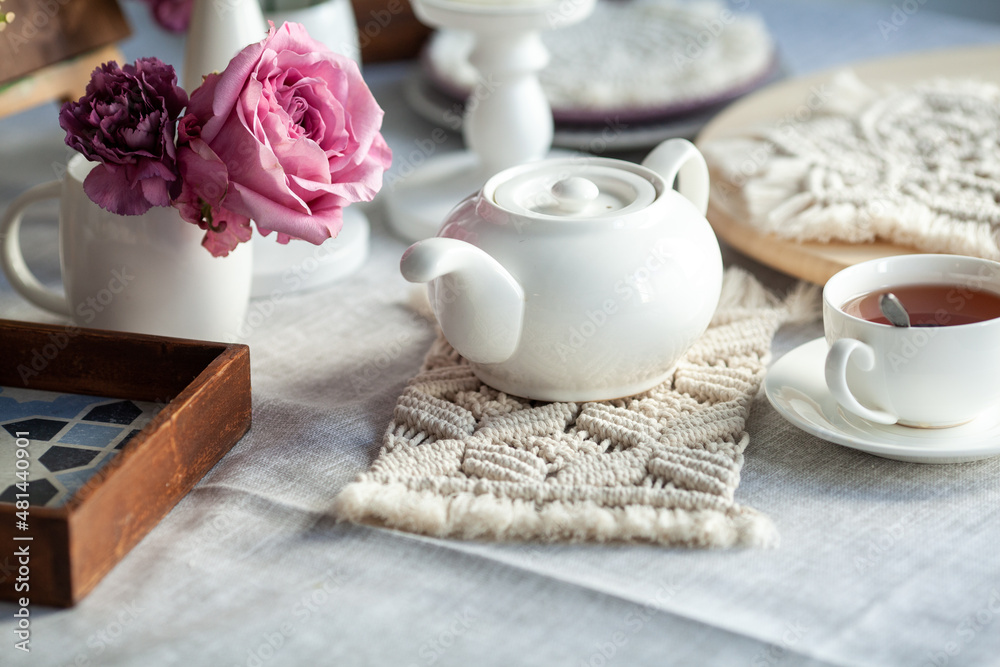 Beautiful table decor. Macrame napkins, flowers Beautiful table decor. Macrame napkins, flowers